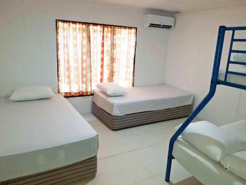 ratu kini backpackers and dive resort