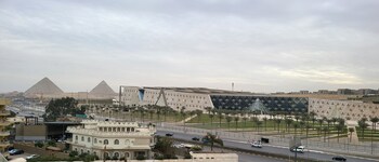 kush hotel grand museum and pyramids view