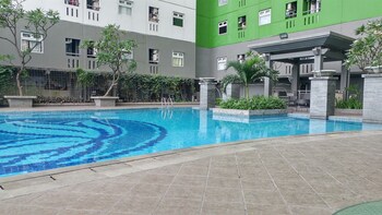 comfy and homey 2br at green pramuka city apartment