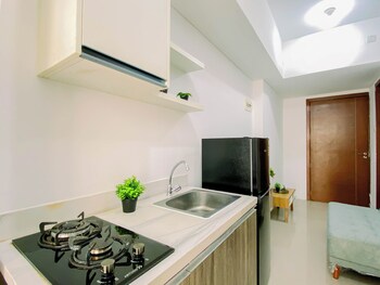 compact white 2br near rawa buaya station at vittoria residence