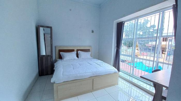 Oyo 93206 Penginapan Budi Syariah,3,Jalan Harapan Jaya,Kelurahan Labuhbaru,2 star
